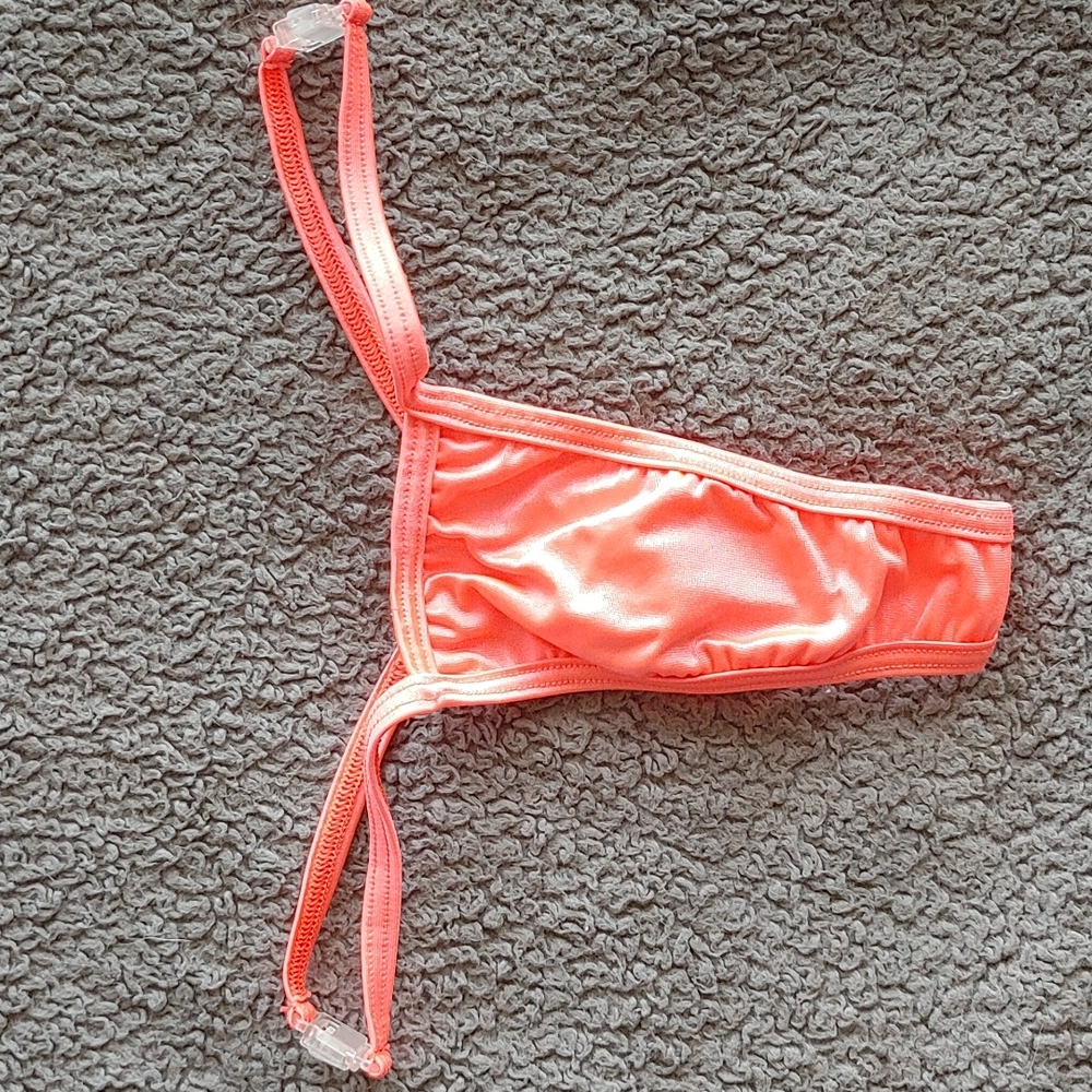Orange thong, one size, clear clasps on side
